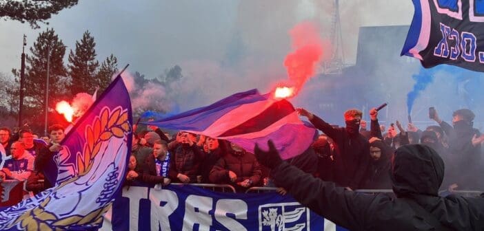 Ipswich Town fans greet the team coach's arrival at Portman Road ahead of the match