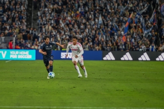 Midfielder Luca de la Torre runs down the pitch with the ball during the inaugural home game at Snapdragon Stadium on Sat. March 1, 2025.