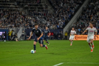 Defender Paddy McNair runs down the pitch with the ball at Snapdragon Stadium on Sat. March 1, 2025.
