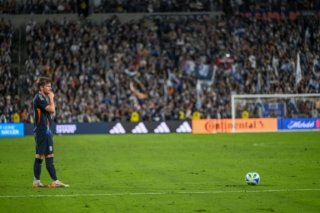 Winger Anders Dreyer sets up for a goal kick.