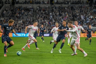 Midfielder Onni Valakari and Forward Marcus Ingvartsen defend the ball from their opponents.