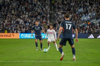 Midfielder Luca de la Torre passes the ball to Defender Paddy McNair at the inaugural game at Snapdragon Stadium on Sat. March 1, 2025.