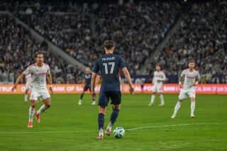 Defender Paddy McNair looks down the pitch before passing the ball